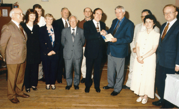 Chairman, Dr. William Nolan, Presents A Copy Of The 1998 Tipperary Historical Journal To Senator Labhrás Ó Murchú Who Launched The Title In Ballingarry.